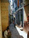 Sun filters through the narrow alleyways of Varanasi