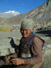 Tibetan woman counting prayer beads